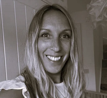 Photo of James Collier in tee on dark background